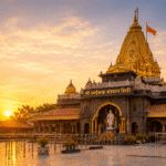 Golden temple-like structure with ornate spire, orange flag, and sunset glow in the courtyard
